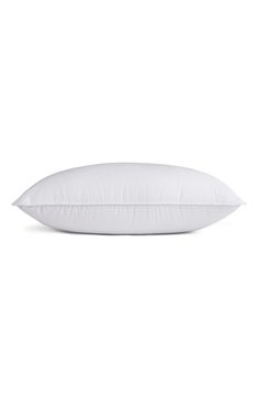 a white pillow on a white background with no image in the frame to describe it