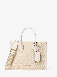 Woven with a kaleidoscopic take on our initials, the Mirella crossbody bag features light-catching metallic threads and a polished MK charm. Its compact size is perfect for days about town. Carry it by the smooth top handles or over the shoulder via the detachable logo-tape strap. Medium Size Purse, Metallic Logo Design, Metal Logo Design, Sac Michael Kors, Affliction Clothing, Bag Logo, Michael Kors Outlet, Michael Kors Purse, Luxury Bag