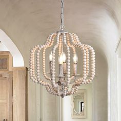 This 4 - Light Candle Style Geometric Chandelier perfectly brings country cottage and farmhouse aesthetics. The living room, bathroom, and hallway are some of the ideal spaces where the beaded chandelier can shine! Even at the entrance of a foyer, this can be a better choice. After all, such a geometry design with vintage touches of this candle-style chandelier can catch people's attention easily. EDISLIVE 4-Light Off-white Farmhouse Led, Dry rated Chandelier | Y81010000037238 Bead Chandelier Bedroom, Beaded Pendant Light, Beaded Lantern, Wooden Bead Chandelier, Geometric Lantern, Bead Chandelier, Dining Room Light Fixture, Geometric Pendant Light, Beaded Candle