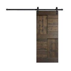 the sliding door is made from wood and has metal bars on each side, along with black hardware