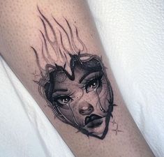 a woman's face is shown with flames coming out of her eyes and on the leg