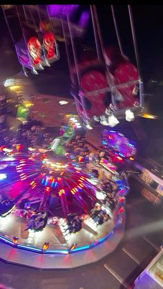 an aerial view of a carnival ride at night