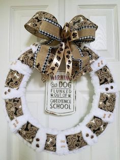 a dog themed wreath hangs on the front door