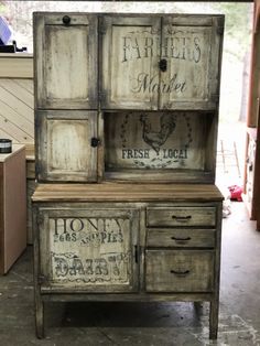 an old wooden cabinet with labels on it