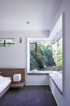 a bedroom with a bed and window in it