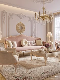 an elegant living room with chandelier and pink furniture