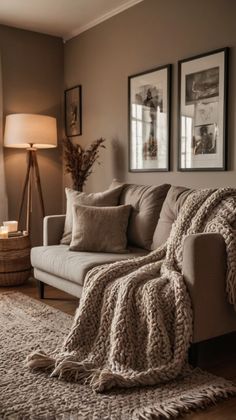 a living room filled with furniture and pictures on the wall