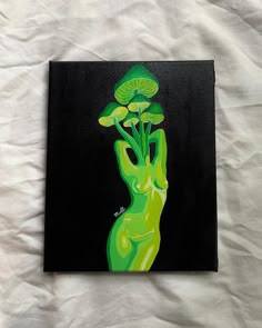 a painting of a green hand holding mushrooms on a black and white sheeted surface