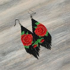 black and red beaded earrings with roses on them