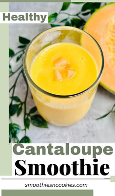 a glass filled with orange smoothie next to sliced melon and green leafy leaves