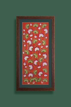 a painting hanging on the wall next to a green wall with a red and white flower pattern