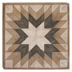 a wooden wall hanging with a star design on the front and back of it's frame