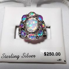 Sterling Silver Rainbow Opal Ring Size 8 This Opal Ring Is Exquisite! It Has All The Colors Of The Rainbow. As You Twist And Turn The Ring And Light Hits It-There Are Many Different Dimensions, Shapes And Designs That Appear. Be The "Talk" Of The Town Or At A Party Or Wherever You Go With This Ring. You Will Really Stand Out Like The Gem You Are With This Ring On Your Finger! Ring Has Only Been Tried On And Is In Original Packaging With Price Tag. No Guarantees Or Warranties Are Being Provided O 4 Stone Opal Ring, Purple Opal Wedding Ring, Fire Opal Engagement Ring Opal Auctions, Australian Opal Ring Opal Auctions, Opal Jewelry Opal Auctions, Opal And Saphire Ring, Peacock Blue Opal Ring, Blue Purple Rings, Purple Opal Gemstone