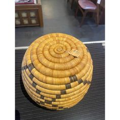 a woven basket sitting on top of a table