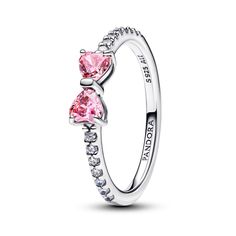 From Pandora, meet the Sparkling Pink Bow Ring: an elegant piece crafted from sterling silver. This versatile ring features two prong-set heart-cut fancy pink cubic zirconia stones as the centerpiece, with a delicate bow motif symbolizing light and festivity. The band is adorned with 14 bead-set round brilliant-cut clear cubic zirconia for added sparkle. Perfect for pairing with both casual and formal outfits, this ring adds a touch of color to any look. Pandora Style #: 193510C01-56 Pink Bow Ring Pandora, Pandora Bow Set, Pink Pandora Ring, Pandora Bow Ring, Promise Rings Aesthetic, Pandora Jewlery, Promise Rings Pandora, Pandora Rings Princess, Pandora Bracelet Charms Ideas