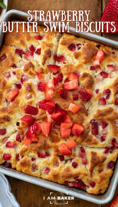 strawberry butter swim biscuits in a baking pan with strawberries on top and the words, strawberry butter swim biscuits