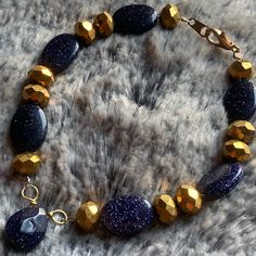 Blue Goldstone Bracelet W/ Gold-Tone Faceted Glass And 18k Gold Plated Hardware. Length: 8” **All Bracelets Can Be Altered** Shorten In Length Possibly Lengthened Change To Magnetic Clasp Let Me Know Of Any Changes When Purchasing. Any Questions? Just Ask. Like An Item But Not The Price? Send An Offer. All Items In My Closet Are Buy 2 Get 1 Free. Adjustable 14k Gold-filled Faceted Beaded Bracelets, Luxury Yellow Gold Blue Topaz Bracelets, Blue Goldstone Bracelet, Blue 14k Gold-filled Bracelet Jewelry, Goldstone Bracelet, Printers Drawer, Blue Goldstone, Buy 2 Get 1 Free, Faceted Glass