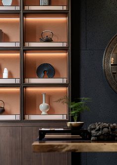 a wooden shelf with vases and other items on it