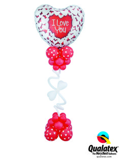 the balloon is shaped like a heart with i love you on it and balloons attached to it