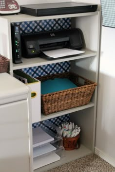 a white book shelf with a printer and other office supplies on it in a room