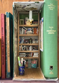 an open book case filled with books next to other books