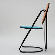 a chair with a blue seat and black frame