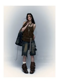 This season's denim style introduces a cool, loose-fitting, casual mid-length shorts as its base. The fake two-piece design with abrupt cut and frayed edges amplifies the distressed, casual, and relaxed details. Irregular cut with washed frayed edges adds to the post-apocalyptic, dejected style. Decorative zippers, rivets, and rhinestones on both sides are deeply embedded in the heavily designed street elements, constantly adding rebellious colors of desolate emotions. Fabric composition: 95% Cotton, 5% Polyester Model's measurements: Height 170cm, Weight 48kg, Bust 76cm, Waist 60cm, Hip 86cm, Wearing size L Trendy Shorts For Alternative Fashion, Trendy Shorts For Summer Alternative Fashion, Trendy Summer Shorts For Alternative Fashion, Distressed Punk Style Jean Shorts, Punk Denim Jean Shorts For Streetwear, Fall Distressed Denim Jean Shorts, Punk Style Ripped Denim Shorts, Punk Ripped Denim Shorts, Punk Distressed Cutoff Shorts