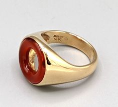 14K Carnelian Designer Ring Kennedy Carnelian Round Stone with 2 Chips 14K Yellow Gold 4MM Band  Size 6 1/2" Can be sized by local Jeweler Weighs 5.2dwt Designer brand Kennedy There are a couple of chips on the stone.... but they are not very eye visible until magnified (see pic 2 at 11o'clock and 2 o'clock) and the ring is just so unique with a hollowed out center and that Kennedy designer touch.  That's been value priced into the ring... a $200 discount off our previous price. CHECK OUT OUR FEEDBACK...100% POSITIVE!   There's a reason we have 100% positive feedback... no one works harder at delivering great value and customer satisfaction than we do.  We treat all our eBay customers as if they were standing in our store!  We're personalized, very responsive and committed to building rela Mid Century Rings, Big Ring, Carnelian Ring, Signet Rings, Gift Inspiration, Big Rings, Jewelry Studio, Couple Rings, Jewelry Inspo