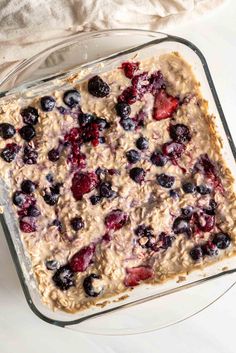 baked oatmeal with berries and blueberries in a glass dish