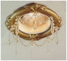 a fancy light fixture hanging from the ceiling