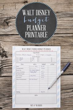 a printable walt and mickey budget planner on a wooden table with a pen next to it