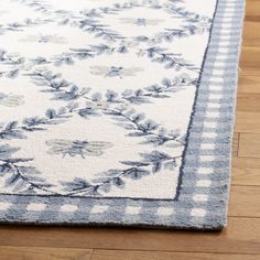 a blue and white rug on the floor