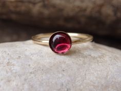 Garnet Gold Ring, Red Gemstone Stacking Ring, Dark Red Minimalist Ring, January Birthstone, Gold Filled Ring, Garnet jewelry, Red Stone Ring This red garnet gold stacking ring will be a perfect gift for women. It is made of 14k gold filled and garnet stone. Measurements: Size- all The center stone is 6 mm The ring will be packed in a gift box. FOR MY RINGS COLLECTION HERE: https://www.etsy.com/il-en/shop/rebekajewelry?section_id=14282915&ref=shopsection_leftnav_9 TO GET TO MY SHOP: https://w Red Minimalist Jewelry With Birthstone, Minimalist Red Birthstone Jewelry, Red Dainty Stackable Jewelry, Dainty Red Stackable Jewelry, Red Solitaire Ruby Ring As A Gift, Dainty Red Ruby Ring As A Gift, Dainty Red Round Jewelry, Minimalist Red Jewelry For Wedding, Red Minimalist Jewelry For Wedding