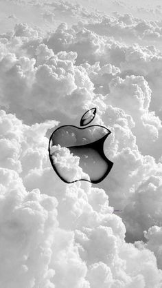 an apple logo is seen above the clouds in this black and white photo taken by someone