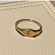 Mejuri Signet Ring 14k Gold Size 7.75 Engraved With The Letter E. Cute As Pinky Ring Or Accent Ring. Custom-Made And Resized Yellow Gold 14k Mejuri Ring In About A Size 7.75 With An 'E' Engraved. Has Some Tiny Marks But Is Still In Beautiful Condition. Very Lightly Worn! Top Width: 6 Mm - Shank Width: 1 Mm Mejuri Signet Ring, Mejuri Rings, Mejuri Jewelry, Letter E, Pinky Ring, Signet Ring, Womens Jewelry Rings, Gold Rings, Initials