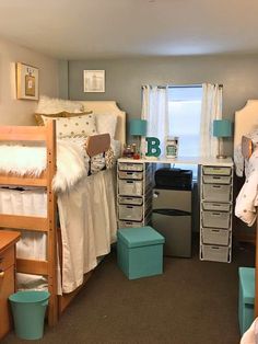 a bedroom with bunk beds and drawers in it