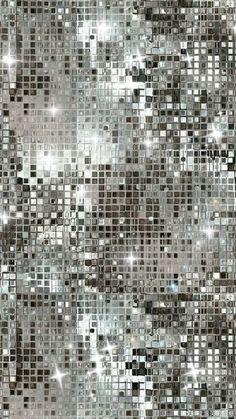 an abstract silver and black background with lots of small square tiles in the middle,