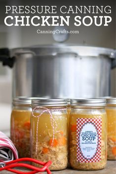 two jars filled with chicken soup sitting on top of a counter next to an instant pressure cooker