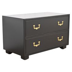 a black and gold dresser with two drawers