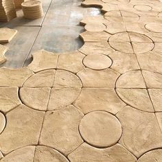 the floor is made out of stone and has circles on it