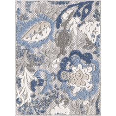 an area rug with blue and white flowers on the front, in grey and gray tones