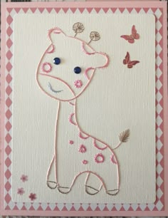 a pink and white card with a giraffe on it's back side