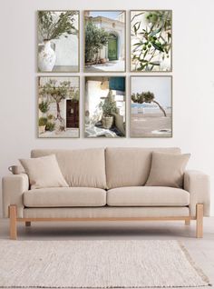 a living room filled with furniture and pictures on the wall above it's couch