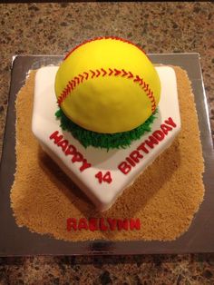 a birthday cake with a baseball on top