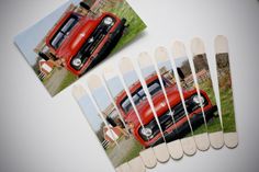 several matchesticks with pictures of trucks on them and one has a red truck