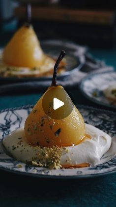 two plates with desserts on them and one has an orange slice in the middle