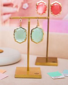 These drop earrings are destined to be your new favorite. Meet the Daphne Gold Drop Earrings in Light Green Mother-of-Pearl, featuring our playful new shape encased in a beautifully textured frame. Perfectly scaled to look gorgeous on everyone, you’ll be reaching for these over and over again. Metal 14k Yellow Gold Over Brass Material Light Green Mother Of Pearl Closure Earwire Size 1.62"L X 0.81"WDue to the one-of-a-kind nature of the medium, exact colors and patterns may vary slightly from the Textured Frame, Sold Out Sign, Pink Iridescent, Gifts Sign, Gold Drop Earrings, Brass Material, Kendra Scott, Mother Of Pearl, Light Green