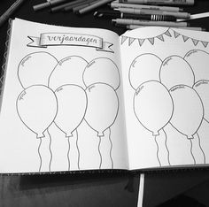 an open notebook with balloons on it