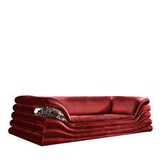 a large red couch sitting on top of a white floor