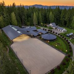 an aerial view of a large house surrounded by trees